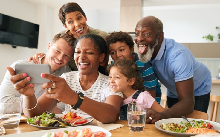 an african american mixed family takes a picture together.
