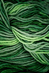 light and dark green yarn strands