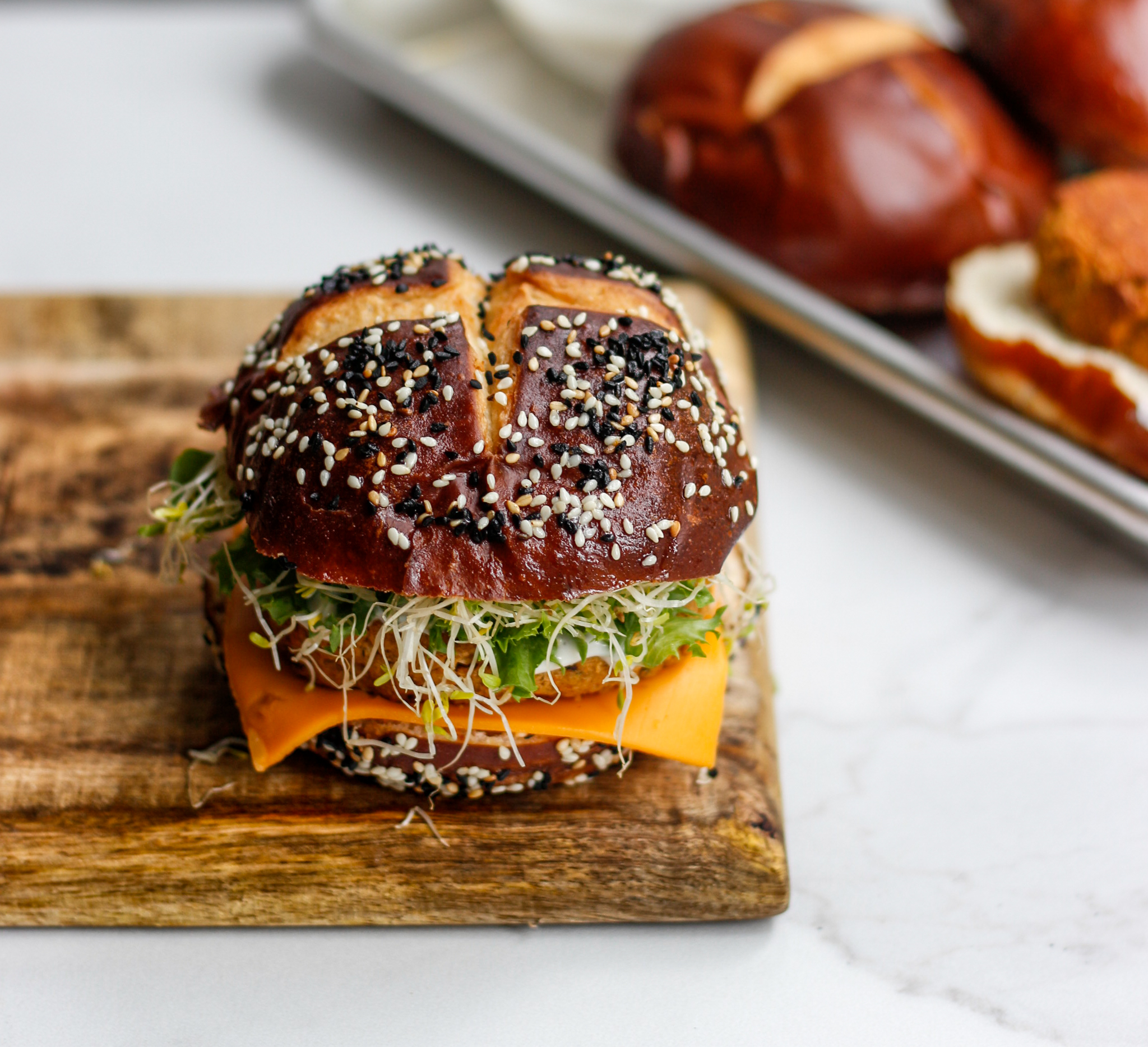 Roasted Cauliflower Chickpea Burger on a Pretzel Bun Fig & Olive Platter