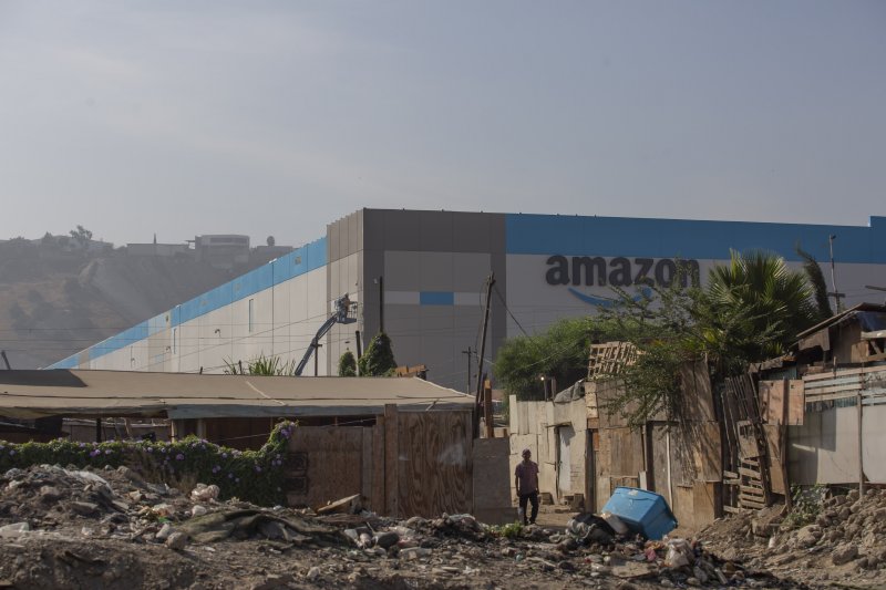 high tech warehouse next to a Mexican slum. This is the