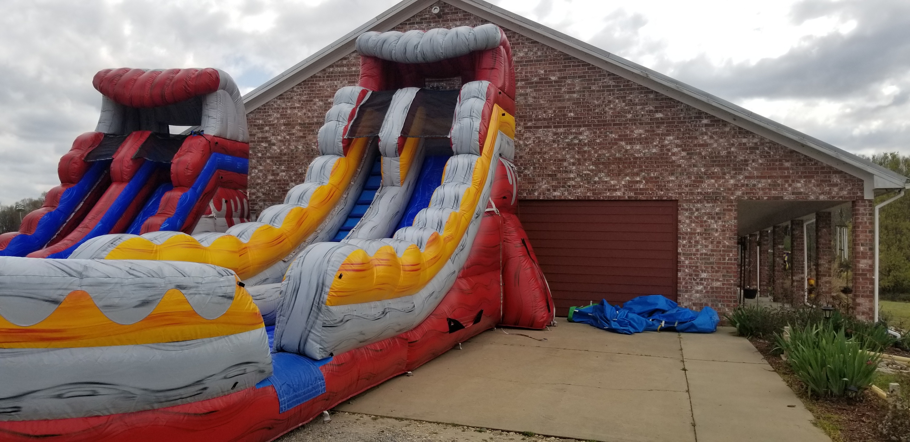 Slipin Slidin Waterslides LLC bounce house rentals and slides for
