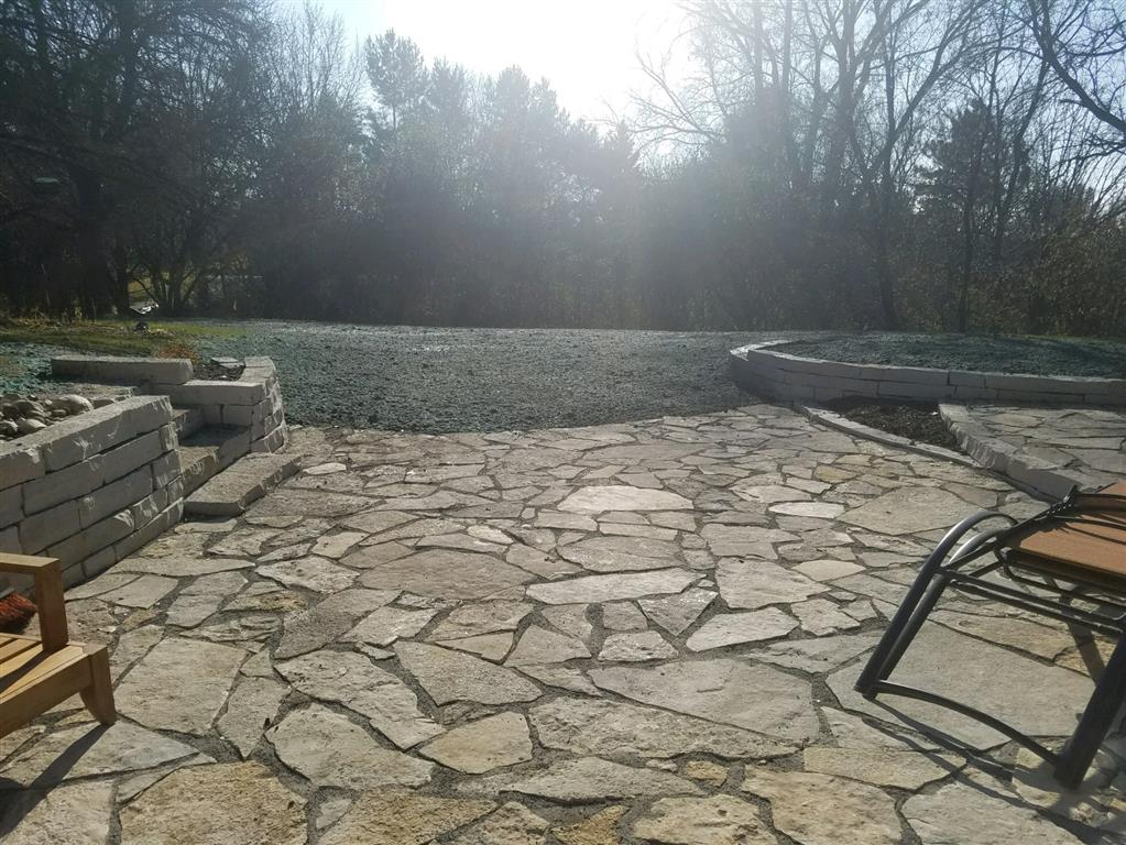Flagstone patios and walls in Sunfish Lake Final Grade, Inc.