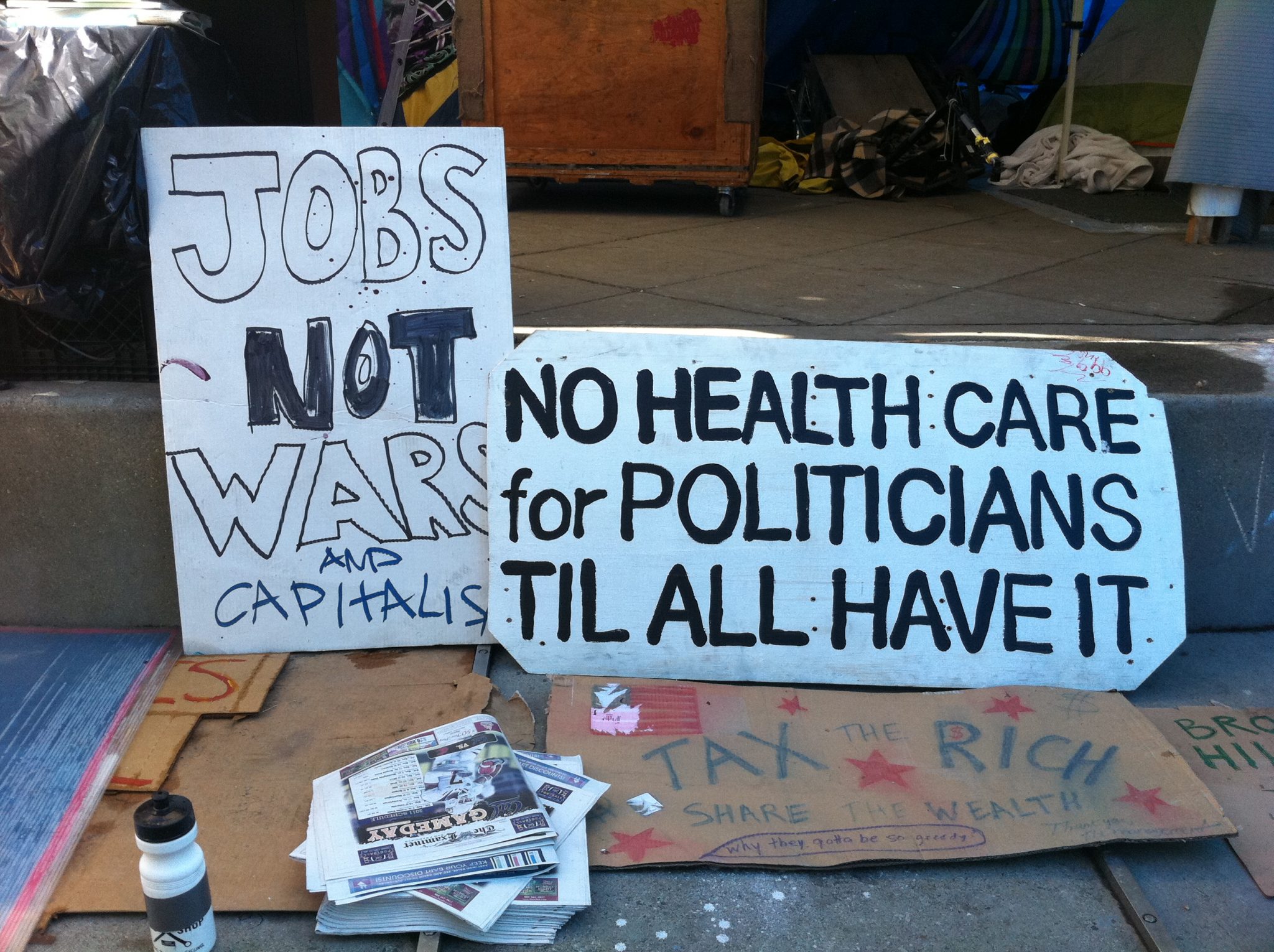 Occupy Protesters - Working Is To Capitalism As Retirement Is To Socialism