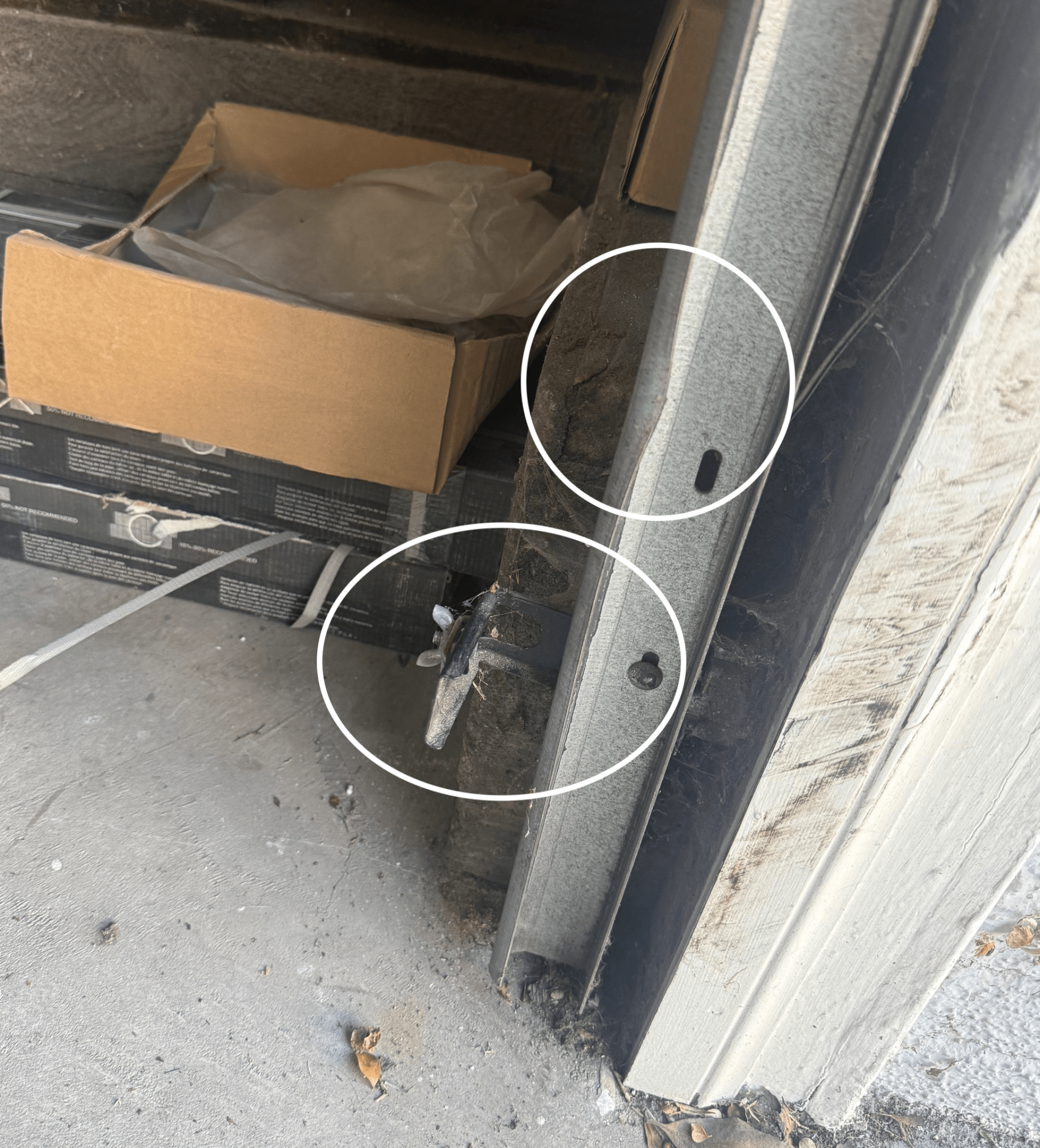 Where's my missing garage door opener sensor? I panicked and called for help. Bent garage rail