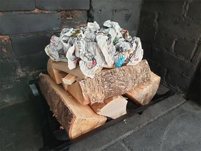 Learn the tips and tricks on how to stack wood in fireplace safely