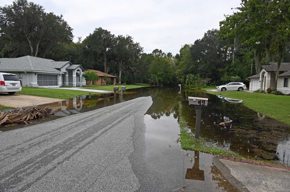 In Palm Coast's Woodlands, Water Is Still Rising and Sandbags Are Being