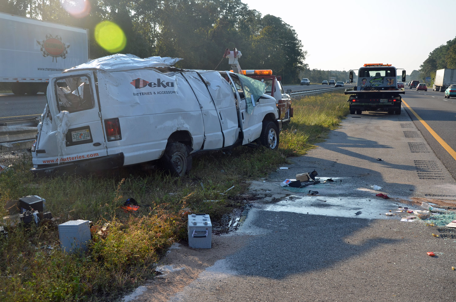 Van Carrying 75 Car Batteries Overturns on I-95 Near SR100, Spilling