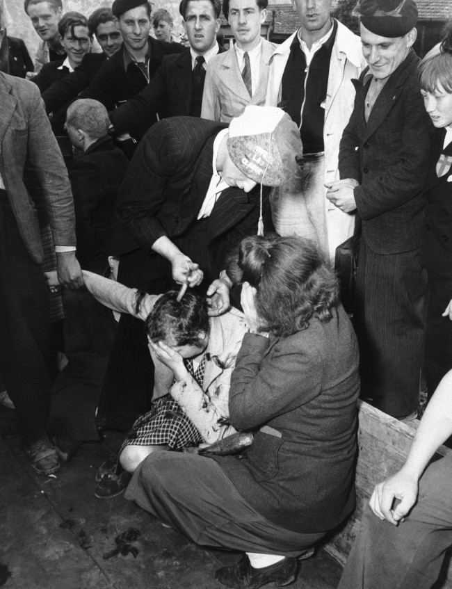 1944 in photos French shave heads of women who collaborated with the