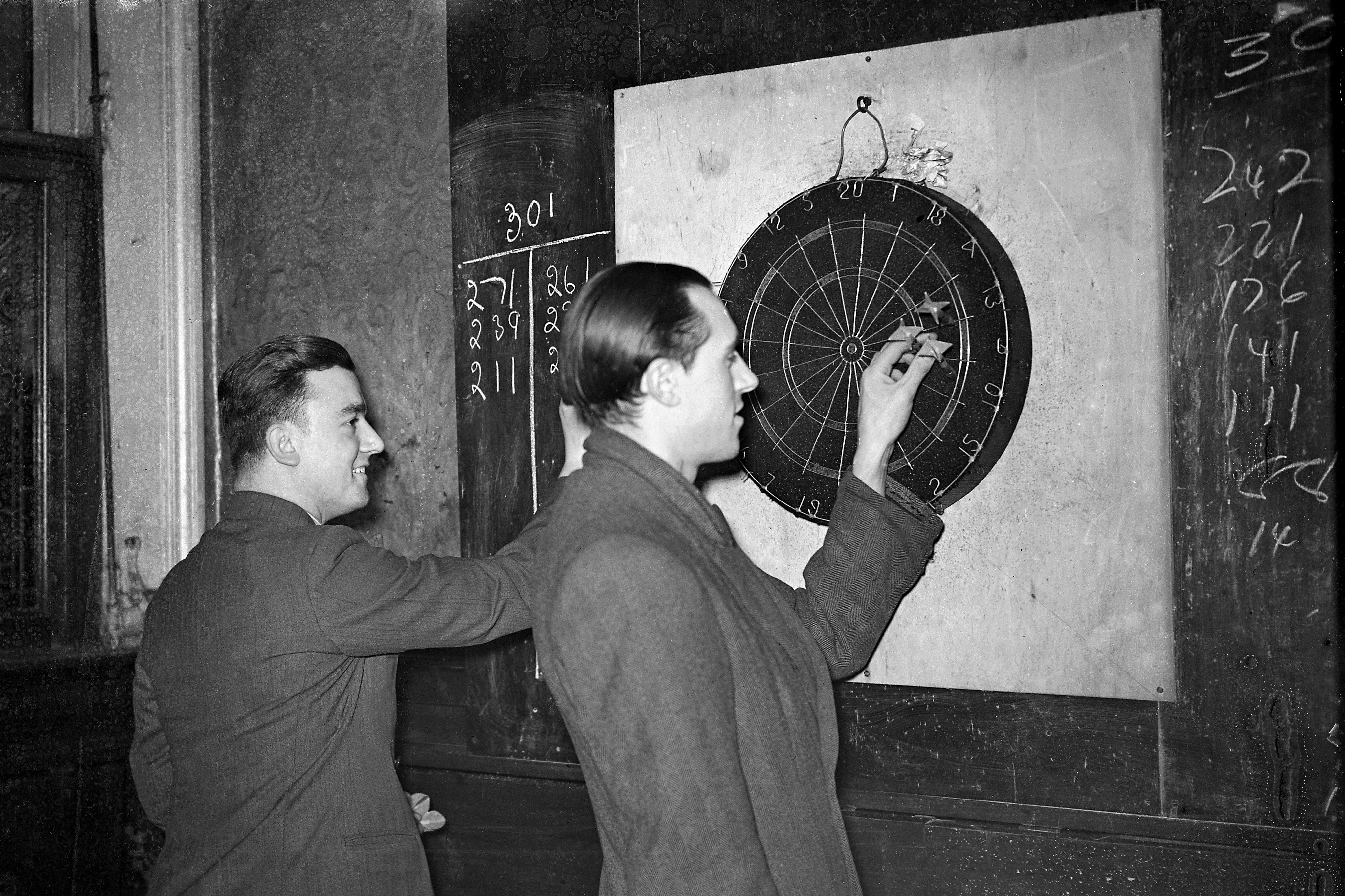 Two Men Play Darts For A Pint Of Beer In A 1930 London Pub Flashbak