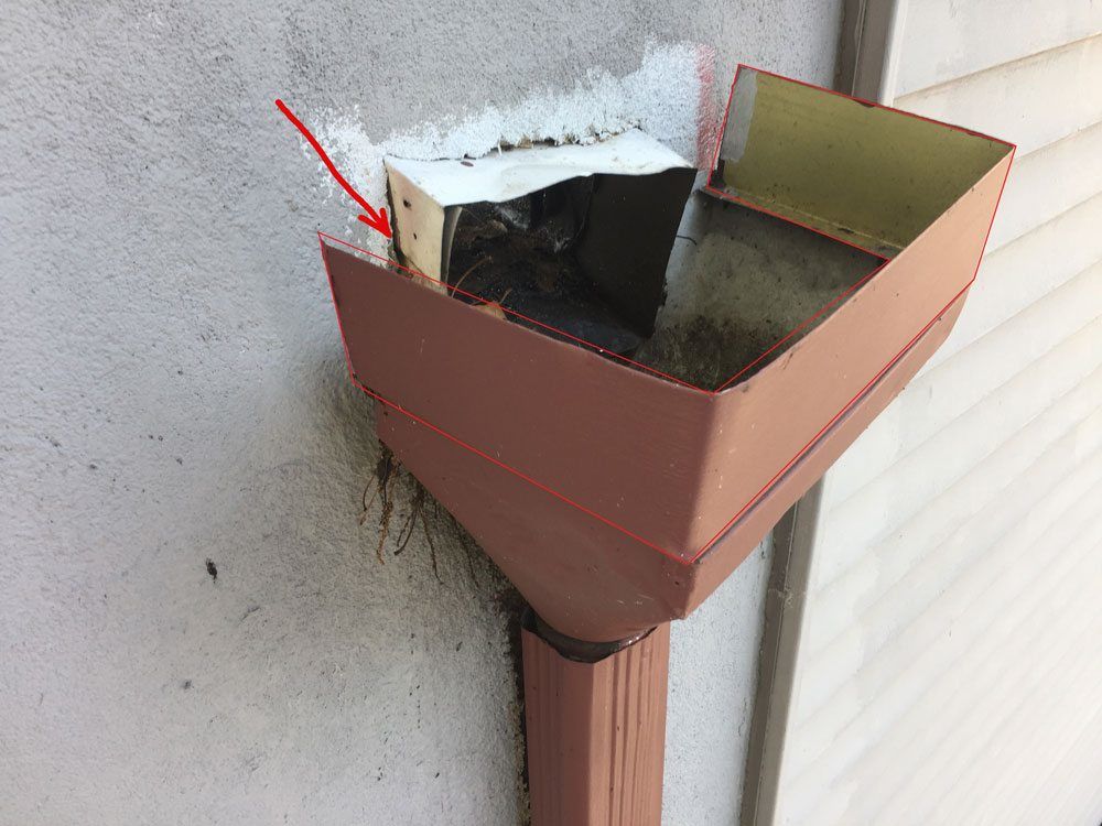 Scuppers Flat Roof Repair blocked leader headersscuppers cause leaks