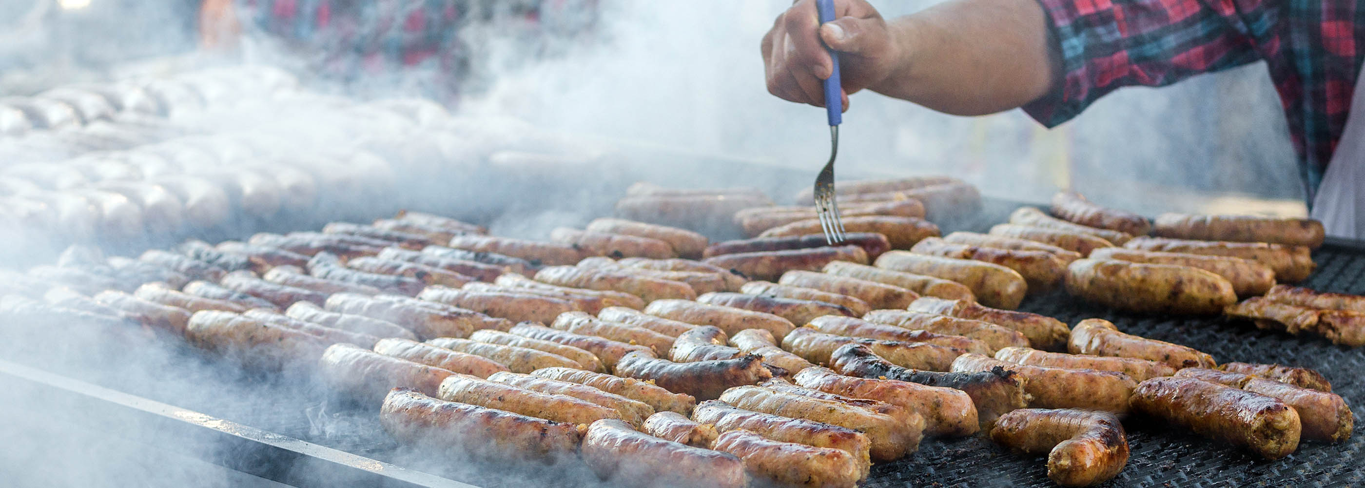 Argentina barbecue asado chorizo sausages cooking on parilla gri Fletcher's