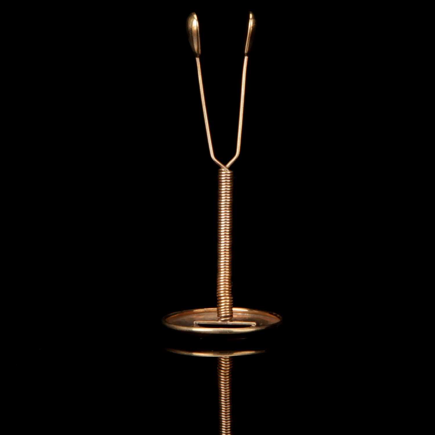 Lot 103 An Early Goldplated Contraceptive Coil,