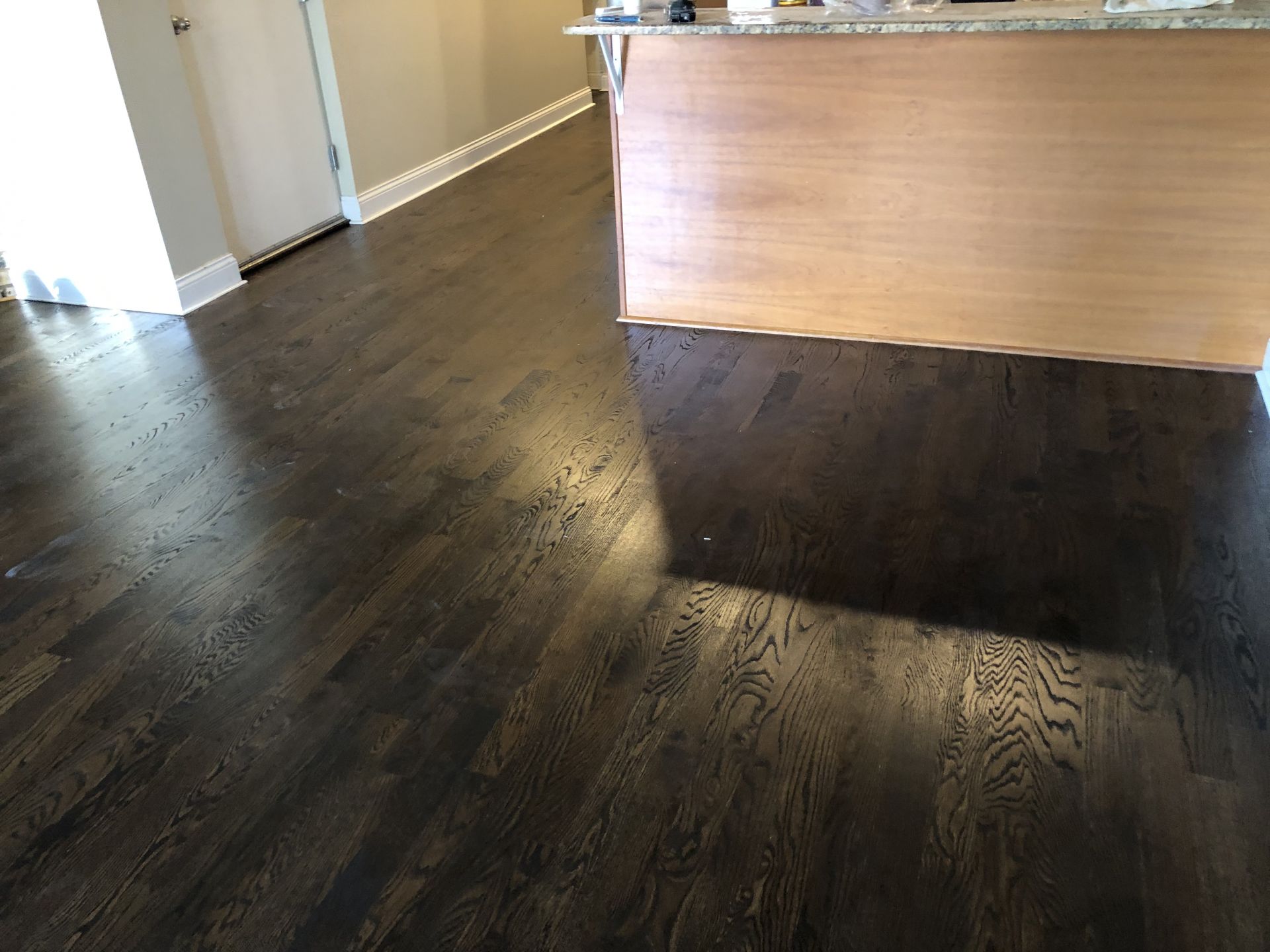 Tile to hardwood kitchen floor transformation Chicago