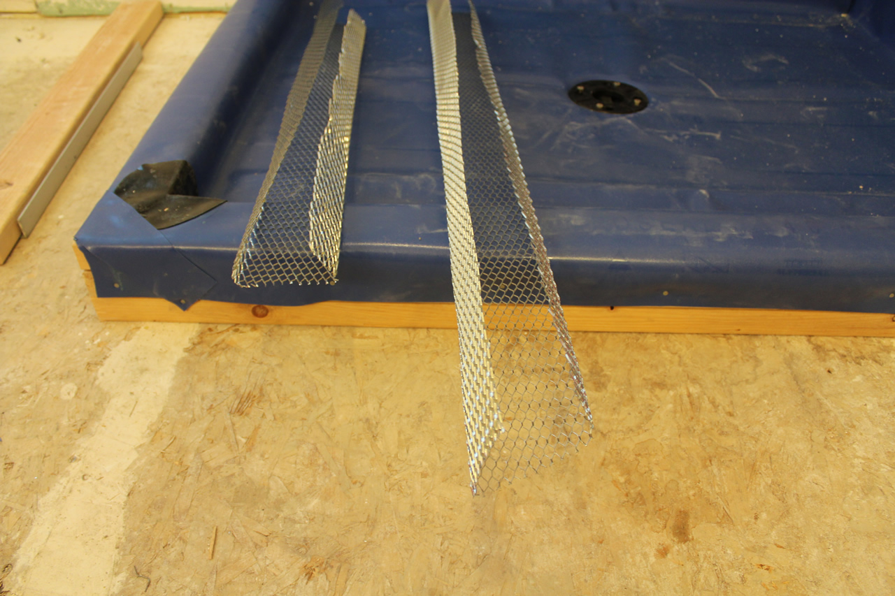 Creating a threshold or curb for your shower