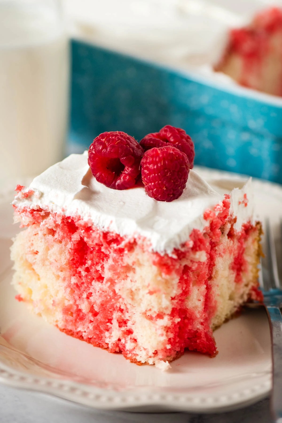 Best Ever Raspberry Poke Cake Recipe with Jello Mix Flour on My Fingers