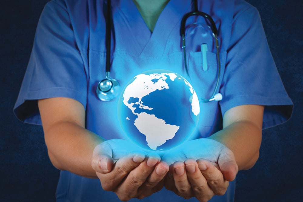 Medical Doctor holding a world globe in his hands as medical net