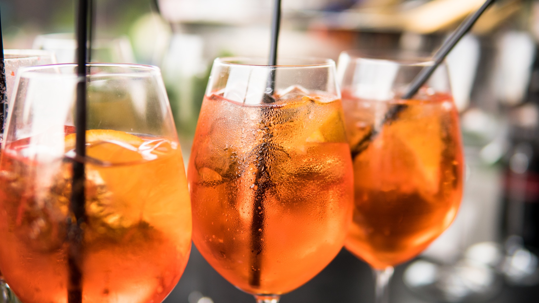 What is a neat drink served with?