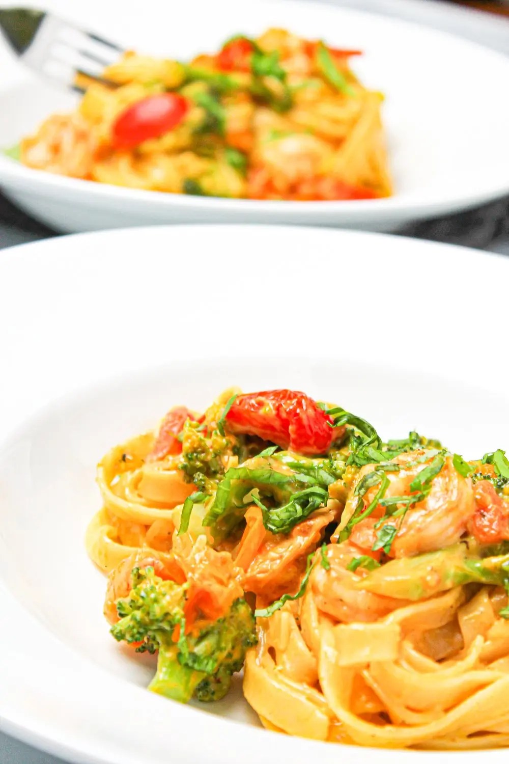 Creamy King Prawn Tagliatelle with Broccoli and cherry tomatoes Fork