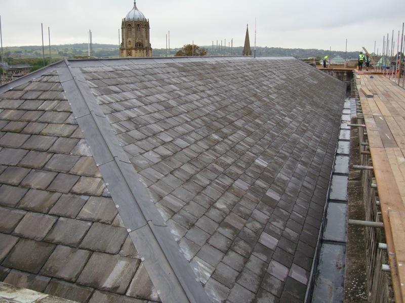 Lead roll ridge v. conventional ridge capping slates. Roofing, Tiling