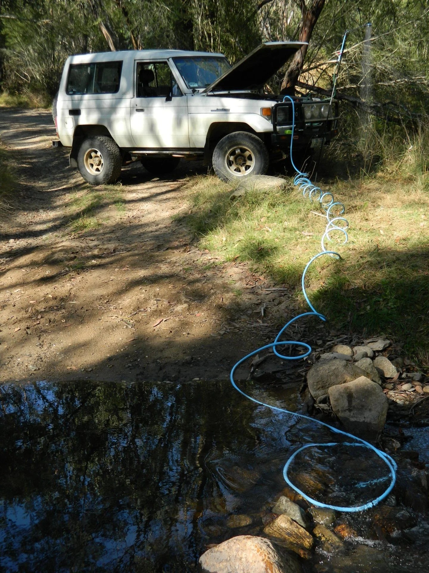 Camping shower, heated from the vehicle radiator coolant system. Page