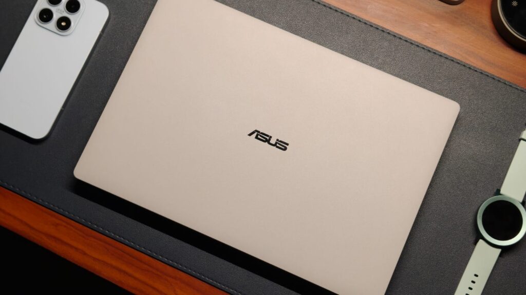 An ALMOST Perfect Professional Laptop: Asus ExpertBook Ultra Review
	
As a tech reviewer, I have a confession to make. Despite my years of testing Windows laptops, I’ve always come back to my MacBook after a review period with a sigh of relief. That’s because, regardless of how expensive a Windows laptop is, it’s never really had the cohesive experience I’ve come to love in Apple’s walled garden. Maybe their speakers aren’t good, or the physical trackpad requires a lot of force to actuate. You get the point. So, when Asus sent over their new executive ExpertBook Ultra, I thought I’d test it out, run a few tests, and be back on my MacBook in no time. Well, that hasn’t happened. 



The Asus ExpertBook Ultra is the first laptop I’ve tested that has crossed that threshold of desirability. But what makes a great Windows business laptop? Some might say portability, while others could point to factors like performance, sufficient RAM, and AI capabilities. What if you want all those features rolled into one? That’s what best describes the Asus ExpertBook Ultra. It starts at ₹2,39,000 or ,499, and is the first laptop to debut Intel’s latest Panther Lake processors. I’ve been testing it for a better part of three weeks now, and this review should help you decide if it’s worth splurging the big bucks. 



        Asus ExpertBook Ultra ReviewHisan KidwaiSummaryThe Asus ExpertBook Ultra is playing a serious game against heavy hitters like the Dell XPS and the Lenovo ThinkPad series. And there’s something for everyone. The design is exceptional, quite possibly the best I’ve tested, with durability that should withstand anything. The 3K Tandem OLED 120Hz display is perfect, and you won’t have to deal with reflections. Let’s not forget the performance that is comfortably a mile ahead of the competition, in both numbers and thermal headroom
        
        


Design & Hardware







I was one of the few journalists invited to the ExpertBook launch event about a month back, and that’s where I first went hands-on with the laptop. The first thought I had was how different it looks and feels compared to other premium laptops. You might know the feeling of the all-aluminum MacBook, but the ExpertBook Ultra is completely different. 



It’s made of CNC-machined magnesium alloy with a ceramic coating on top. It’s hard to put it into words, but the finish feels textured, almost powdery in a way, yet still very premium. You also don’t have to deal with smudges and fingerprint stains on your expensive machine. Color options are limited to two: either black or an off-white. I got the Morn Grey unit, and it’s definitely the way to go. Thanks to the texture, the color shimmers in sunlight, and wherever I went with the laptop, people asked what I was using. 



A business laptop is for those who’re running from one office or coffee shop to another, most of the time with a laptop in hand. This means portability and weight are the main concerns. When I first picked up the ExpertBook Ultra, I expected it to weigh a decent amount because of its powerful internals. Well, looks can certainly be deceiving since it only weighs 0.99 kg, which is quite frankly insane. For context, my  MacBook Air M1 weighs 1.29 kgs. And this weight difference is noticeable when carrying the laptop every day.







But you might ask, if the Ultra doesn’t weigh much, surely it won’t be durable. That surely won’t be the case, as ExpertBook laptops are the most durable machines I’ve ever tested. I’ve even stood on one, and it escaped without any damage. The Ultra is MIL-STD-810H-rated and should survive several bumps and drops just fine. At the event, Asus also told us to hold it up by the corner of the screen for a photo, which was a weird flex.



Since connecting to other gadgets is a basic requirement in an office, the ExpertBook Ultra has a decent selection of ports. You get dual Thunderbolt 4 USB-C (one on each side), along with a full-size HDMI 2.1, a USB 3.2 Type-A, and a headphone/microphone combo jack. 



Best Windows Keyboard & Trackpad Combo







From spending over five years in the MacBook world, I’ve grown accustomed to the haptic touchpad, and it’s easy to see why. A haptic trackpad eliminates one more physical component, making it durable and ensuring consistent actuation energy wherever you click. That’s something Windows laptops have suffered from for years, because clicking on the top corners requires more force than moving a mountain. 



The ExpertBook Ultra is one of the few laptops that has fixed this problem, and I couldn’t be happier. The trackpad is a large glass surface that spans edge to edge and comprises six pressure sensors. I found the tracking to be exceptionally good, without that sticky feeling. While the pressure actuation was a little lower than on the MacBook, I got used to it in no time. The palm rejection works beautifully, and the gestures are well supported. 



The keyboard is high on the priority list of professionals, and Asus has kept that in mind. The layout is fairly standard in the sense that there is no learning curve. All keys are in the correct place, and even the 1.5mm travel is pretty respectable. The keys feel tactile without making much noise. There are different stages of backlit, and it’s bright enough to overcome the lack of contrast with the white keyboard deck. Still, the best part about the ExpertBook Ultra’s keyboard is that it’s splash-resistant. A small coffee spill or splash of water shouldn’t cause any issues as long as you clean it up quickly.



Display & Camera







We’ve seen OLED displays on laptops for quite some time. In fact, Asus was one of the first to implement it. Still, they are yet to reach the masses because OLED panels, unlike those on phones, consume more power. That’s one problem the Asus ExpertBook Ultra doesn’t have because it uses a 14-inch 3K Tandem OLED with a 120Hz refresh rate. For the uninitiated, a Tandem OLED panel combines multiple layers of light-emitting organic material to deliver higher brightness and lower power consumption. Thanks to this, the laptop has a peak brightness of over 1400 nits in HDR and 600 nits in regular mode. 



If I had to use just one word to describe the Ultra’s display, it would be perfect. You can’t get any better than this, with colors that look exceptionally vibrant thanks to 100% DCI-P3 coverage, Pantone validation, and a Delta-E of less than 1. That’s more than enough for creative work like video editing without a hitch. As expected, movies and TV shows were a dream to watch.







That’s not all, as the laptop fixes one major pain point I’ve had with premium laptops. That’s glossy displays. They pick up dust quickly and get dirty with smudges that are almost impossible to clean. With the ExpertBook Ultra, you get a matte glass panel that cancels out almost all reflections pretty effectively, meaning I could work with the sun shining behind my back. Just don’t try this in 45-degree heat. Another upside is the touch functionality. Say what you want, touch is great for working on the go. For the people concerned with durability, Asus has used Gorilla Glass Victus, which is super durable. Enough to withstand over 100 kg of pressure, as they showcased in the event.



The 1080p webcam on the ExpertBook Ultra is perhaps the only thing that’s not very special. It’s decent for calls, and looks comparable to the MacBook. The wide field of view means you don’t have to squeeze into the frame during presentations, and it also supports Windows Hello functionality. 



Performance







No business laptop will ever be desirable if it doesn’t have enough power to run multiple apps. Since the Asus ExpertBook Ultra is the first to get the Panther Lake chips, specifically the Core Ultra X7 358H, I was quite excited to test it out. The processor has a total of 16 cores, out of which four are performance cores, another eight are efficiency cores, and the last four are low-power efficiency cores. It’s paired with 32GB of LPDDR5x RAM at 8533 transfers per second and 2TB of Gen 5 storage, which can achieve read speeds over 14,000 MB/s. 



As expected, the laptop feels effortlessly fast in everyday use. For example, my work is mainly on Chrome and Slack, where the processor handled everything super efficiently. I could open up more tabs than I need without a hitch, all while still running something in the background. Productivity apps are handled similarly well, and I connected them to my 2K monitor, where the experience was absolutely spotless. 



What I found fascinating about the Ultra is that it’s not just a laptop for business people. In fact, if you’re a creator and need a serious on-the-go machine, you actually could take a look here. That’s because I fired up Da Vinci Resolve and tried my hand at editing a 4K reel I shot in Thailand. While my editing skills need a lot of sharpening, the Ultra could handle multiple streams of 4K videos and even play them back without slowing down. I also added some color grading to the videos, and it all went fine. In typical Asus fashion, there are several AI-centric features, such as MyExpert. It’s a personalized AI chatbot that quickly helps with your needs with on-device processing. 







Since my skill set with demanding tasks only goes so far, I also ran a series of benchmarks to see how the Panther Lake processor ranks among its peers. Starting with Cinebench R24, the Ultra X7 358H scored 1,019 points in the multi-core test, roughly doubling the performance of the Ultra 7 258H, found in the likes of the ThinkPad X Carbon. With PCMark 10, we saw a 30% jump in the Ultra X7 358H’s performance compared to last-gen alternatives, reaching scores of 9,903.



Graphics in the ExpertBook Ultra are handled by the integrated Arc B390 GPU. Intel’s recent emphasis on GPUs means the B390 means serious business. I put it to the test with 3DMark’s TimeSpy test, where it scored 6,712 points. To put this number in context, though, I also played a series of games. Don’t get me wrong, the ExpertBook Ultra is not designed for serious gaming, but can it play AA or sometimes even AAA games? Yes, absolutely. Starting with lighter titles like F1 2025, I easily got over 100 fps on High settings with XeSS turned off. Kicking things up to titles like Indiana Jones: The Great Circle and Cyberpunk 2077, I averaged around 50-60 fps at 1080p with Ultra detail settings. If you’re concerned with eSports titles like Counter-Strike 2 and Valorant, they won’t break the ExpertBook Ultra, as it can easily achieve full 120 fps at the highest settings. 



Battery Life & Speakers







While the 70Whr cell is pretty standard for a thin-and-light laptop, Asus has incorporated a new 2S2P architecture, which, in theory, is more efficient. My testing proved that theory to be right. On an average workday, which includes spending hours on Chrome, watching YouTube, and a few episodes of Better Call Saul, the ExpertBook Ultra lasted me a full day with some charge left to spare. Charging is handled with a 90W USB-C PD charger, which means you can go from 0%-50% in just thirty minutes. That’s enough time to charge between meetings and have enough for your super-long presentation. 



Speakers on Windows laptops have usually not been a priority for forever. Most of them fire directly on the table, which inherently limits their output. But the Asus ExpertBook Ultra is the first laptop I’ve heard of that blew my MacBook out of the park. The speakers, of which there are six, sound at least twice as loud, with a wider soundstage, accurate dialogues, and bass that hits the spot. The treble is usually on point. You can make out the different instruments, and the highs don’t screech the ears at all. Almost everyone whom I showed the Ultra’s speakers was in awe of the quality, so you know it’s not just me yapping. 



Verdict







Starting at ₹2,39,000, the Asus ExpertBook Ultra is playing a serious game against heavy hitters like the Dell XPS and the Lenovo ThinkPad series. Asus markets it like a business laptop, but my testing found the ExpertBook Ultra to be more capable than just handling spreadsheets. It’s a machine that caters to power users, irrespective of whether they work in an office or from a cozy cafe in Bali, editing videos or programming for their clients. 



There’s something for everyone. The design is exceptional, quite possibly the best I’ve tested, with durability that should withstand anything. The 3K Tandem OLED 120Hz display is perfect, and you won’t have to deal with reflections. Let’s not forget the performance that is comfortably a mile ahead of the competition, in both numbers and thermal headroom. Sure, Dell and Lenovo are more established names when it comes to professional laptops, but I think it’s time we give Asus that status as well. And if you’re shopping in the segment, it’ll be a shame not to consider the ExpertBook Ultra. 

#Perfect #Professional #Laptop #Asus #ExpertBook #Ultra #ReviewAsus