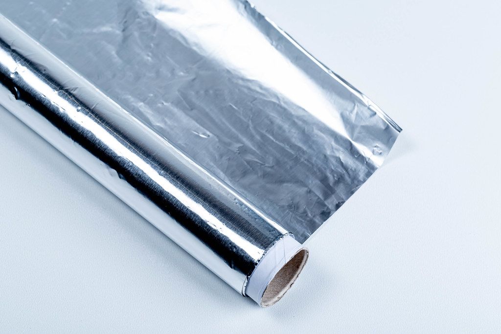 Grilled Eggs wrapped in Aluminium Foil on a Barbecue Grill Creative