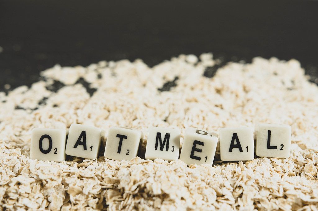Dice reading OATMEAL over oats Creative Commons Bilder