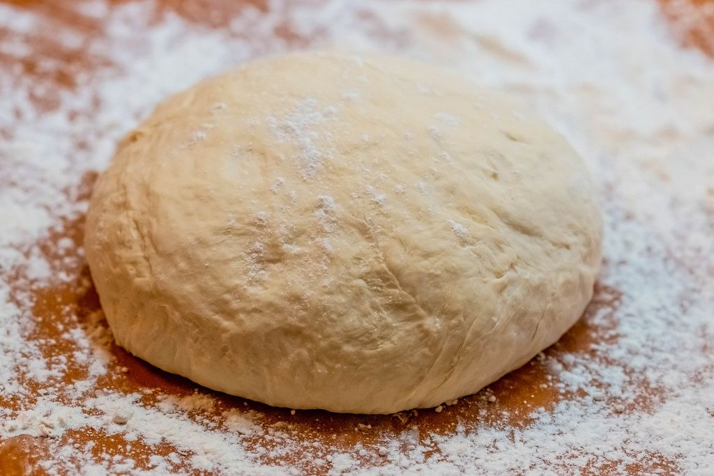 The stack of dough cut into a rectangle shape. Dough for cooking