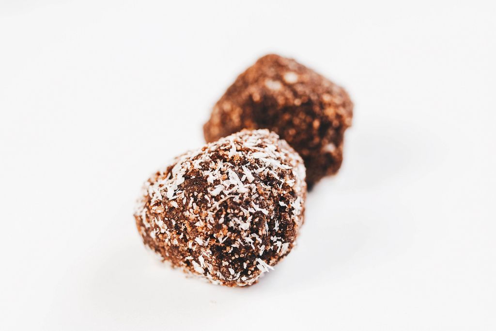 Energy Balls with Date Palm fruits Almonds Walnuts and Coconut in the