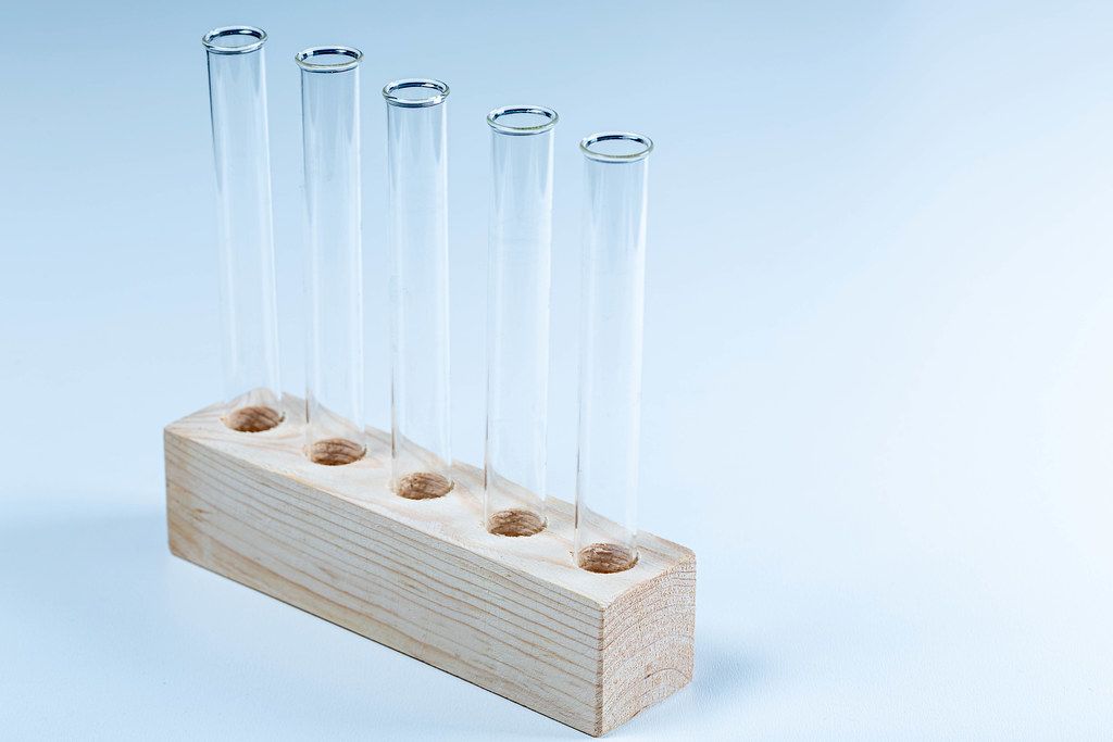Glass test tubes closeup. The concept of research (Flip 2020