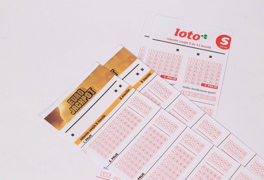 Young Man with a Wheelchair selling Lottery Tickets at a Street Night