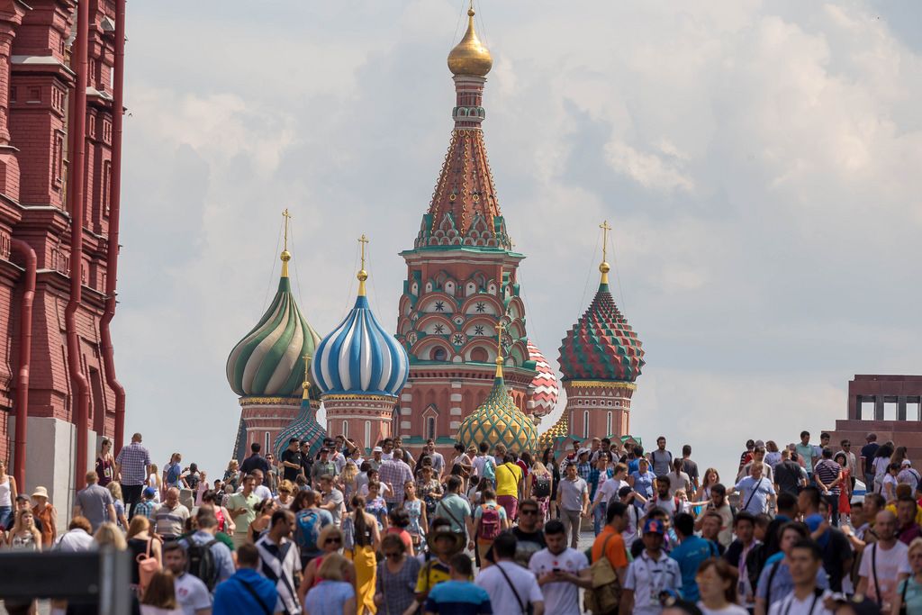 St Basil 2023 Christmas Bazaar Linxoln Ri Tourists at Red Square with the Saint Basil's Cathedral in the