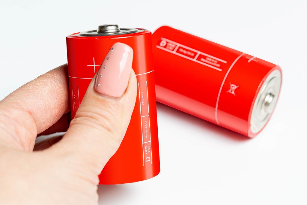 Set of round batteries of different sizes in a package Creative