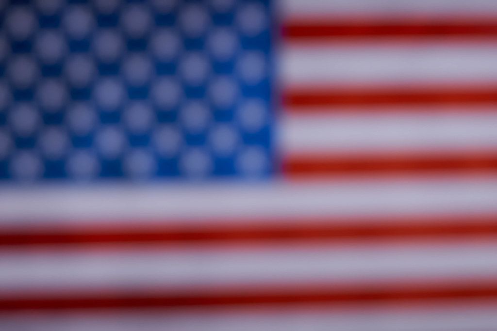 A woman holding american flag Creative Commons Bilder