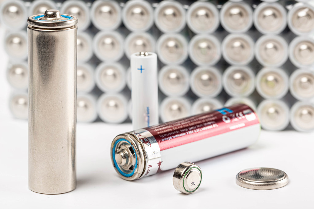 Set of round batteries of different sizes in a package Creative