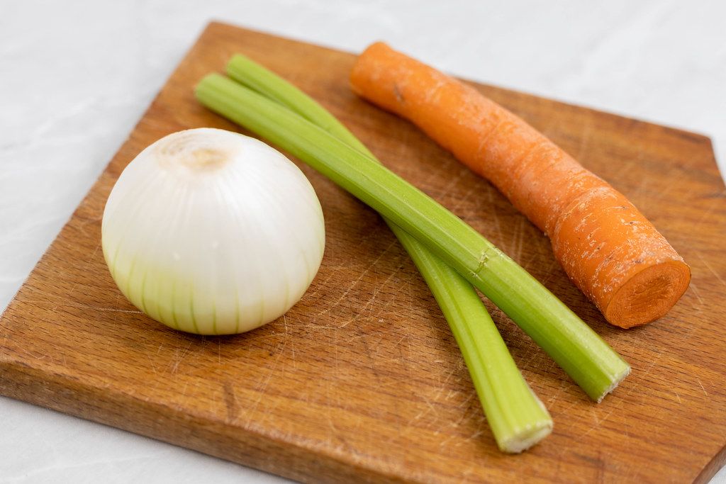 Carrot Celery and Onion on the wooden board Creative Commons Bilder