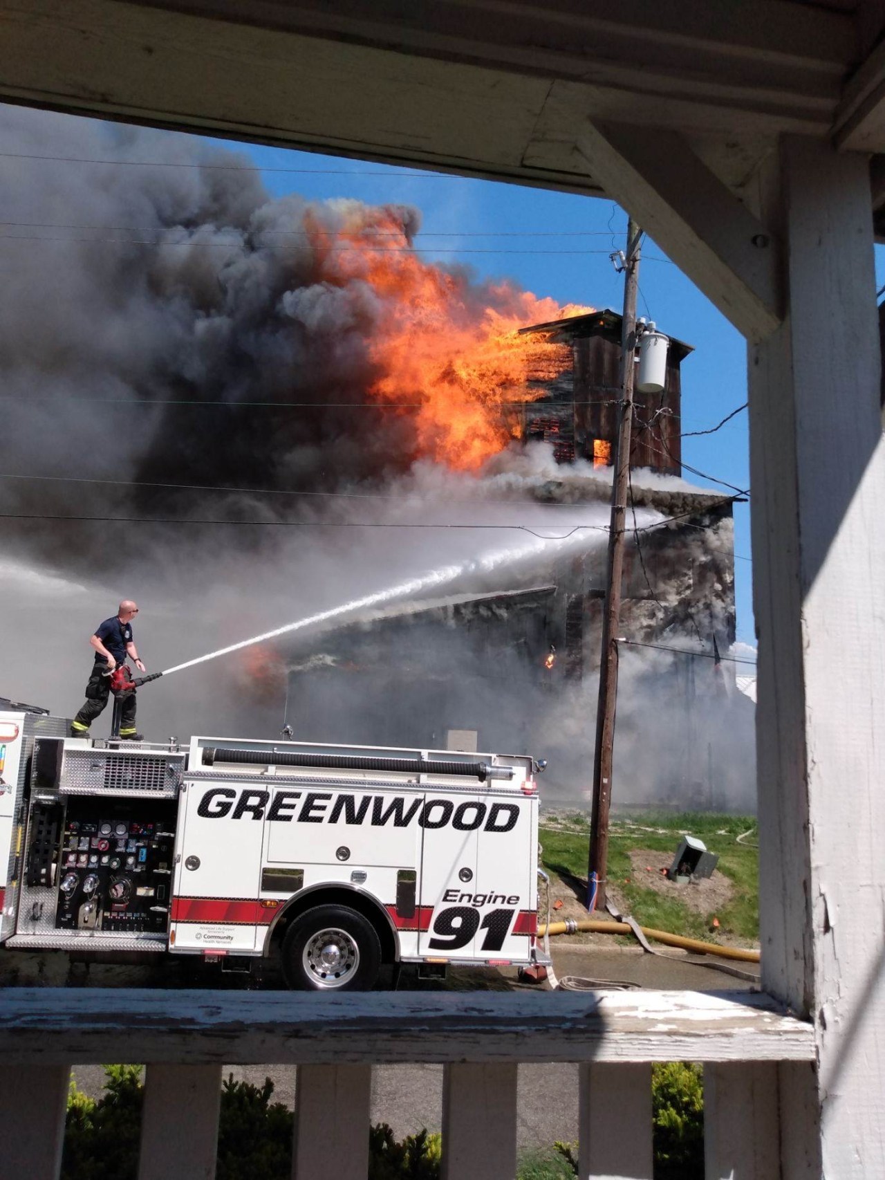 Historic downtown Greenwood farm coop catches fire, collapses
