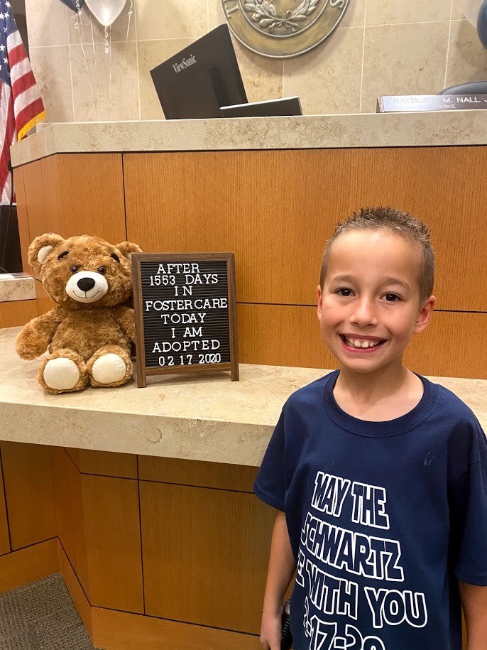 Hundreds gather to watch little boy's adoption after 1,553 days in