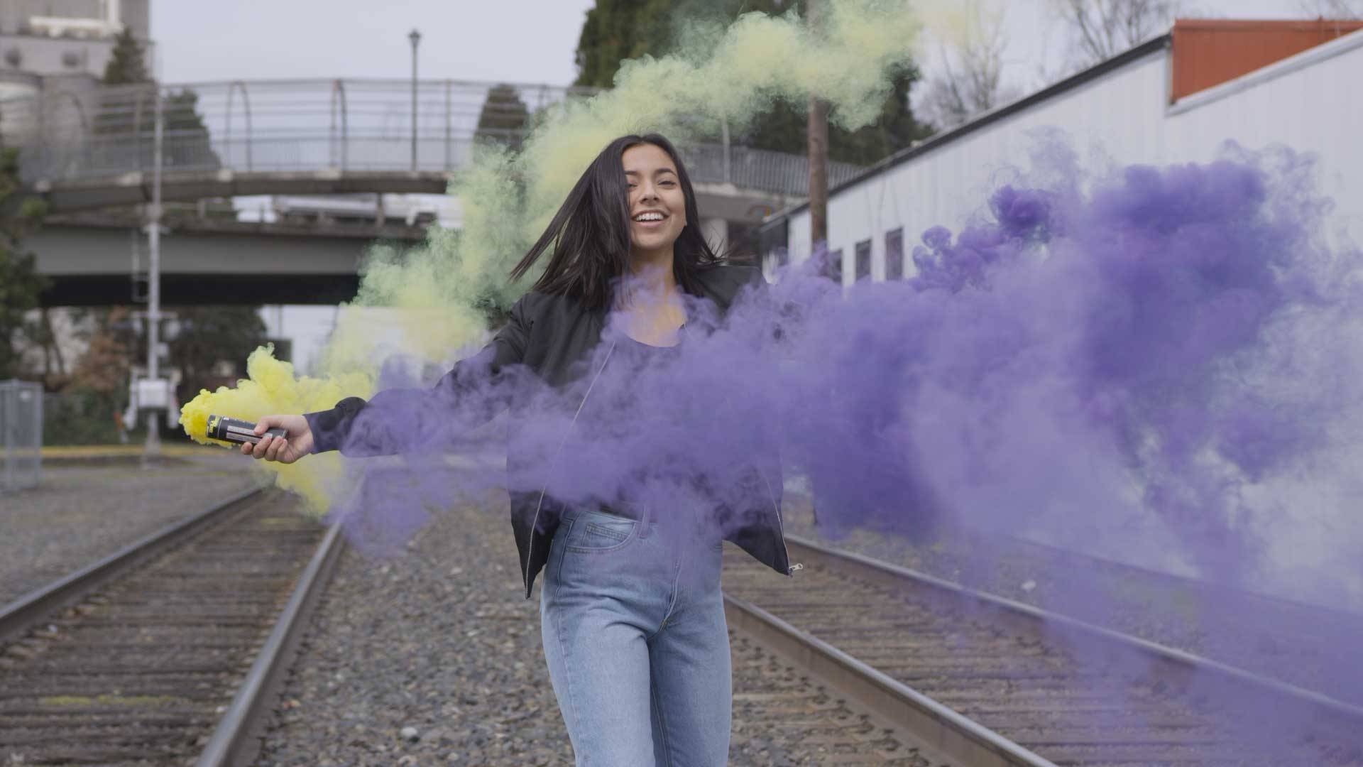 Young Woman Holding Smoke Bomb FILMPAC