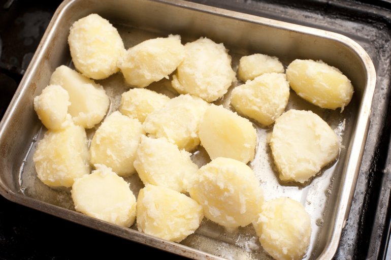 Par boiled potatoes ready for roasting Free Stock Image