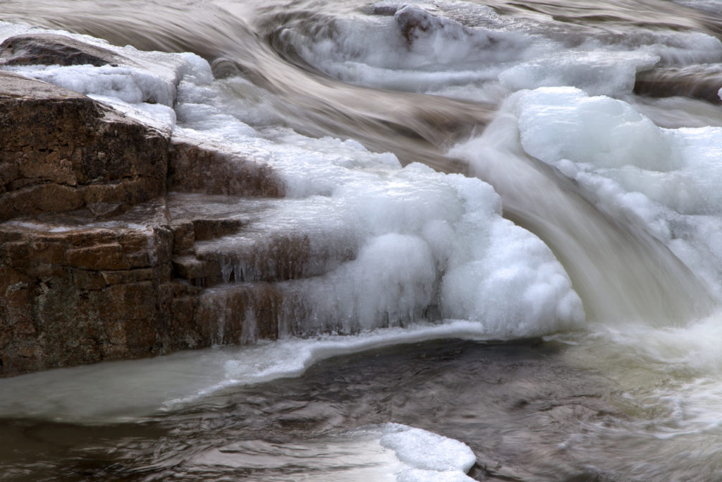 Water Flowing Through Frozen River Free Nature Stock