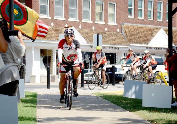 Courtesy Cherokee Nation Remember the Removal Bike Ride Elder Ambassador and Cherokee Nation citizen Sammy Houseberg leads the cyclists to the Cherokee Nation Courthouse as they complete the 950-mile trek.