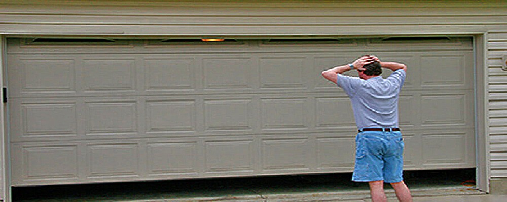 What Is Causing My Garage Door to Be Jammed? - Friendly Garage Doors