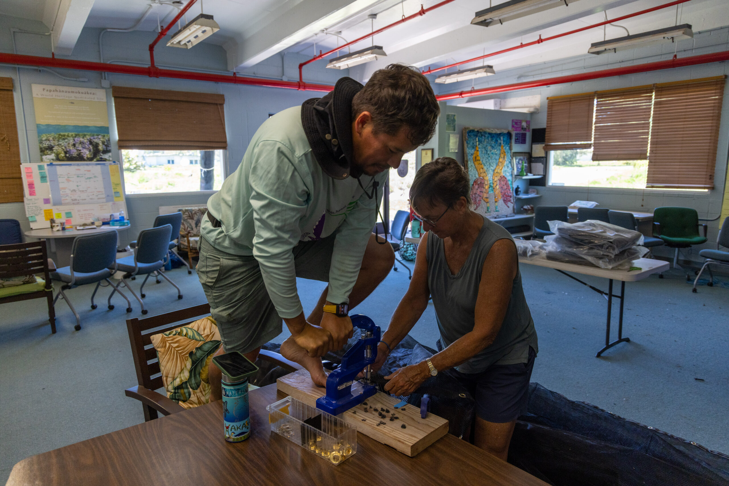 A man and woman help to build a bird sanctuary