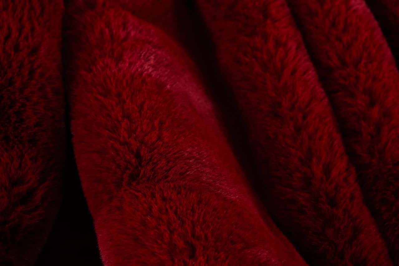 Cassilda Luxury Red Chinchilla Faux Fur Throw Blanket by Amazing Rugs