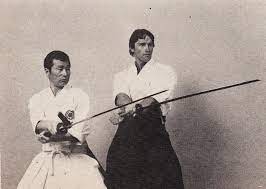 Arnold Schwarzenegger along with his martial arts teacher Kyoshi Yamazaki