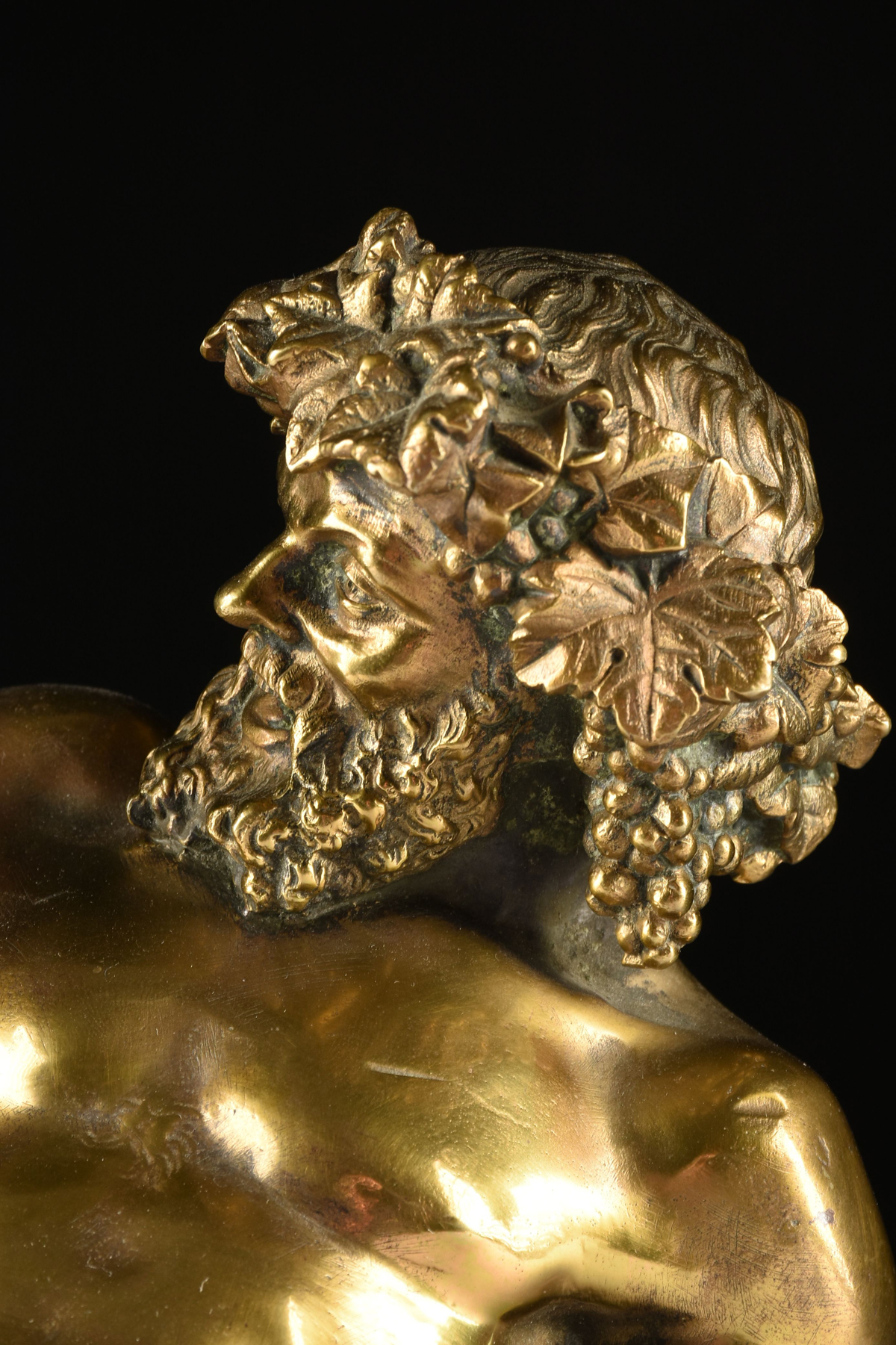AFTER THE ANTIQUE GILT BRONZE SCULPTURE OF A DRUNKEN BACCHUS, SIGNED