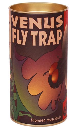 A close up vertical image of a small tube containing a growing kit for the carnivorous plant the venus flytrap pictured on a white background.