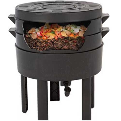 A close up square image of a plastic worm farm pictured on a white background.