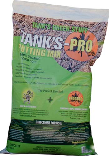 A close up vertical image of a bag of Tank’s-Pro Potting Mix isolated on a white background.
